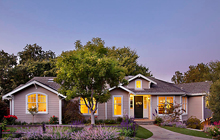 A house in the middle of a yard.