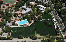 An aerial view of a campus with a baseball field.